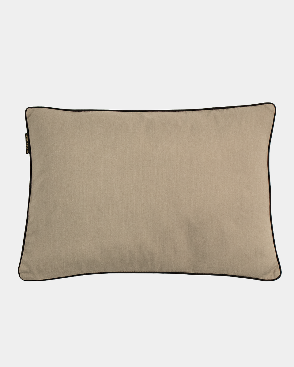 A rectangular beige pillow with black piping trim, shown flat against a light gray background.