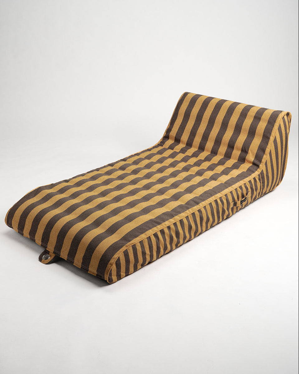 Striped sun lounge with brown and saffron pattern on a white background