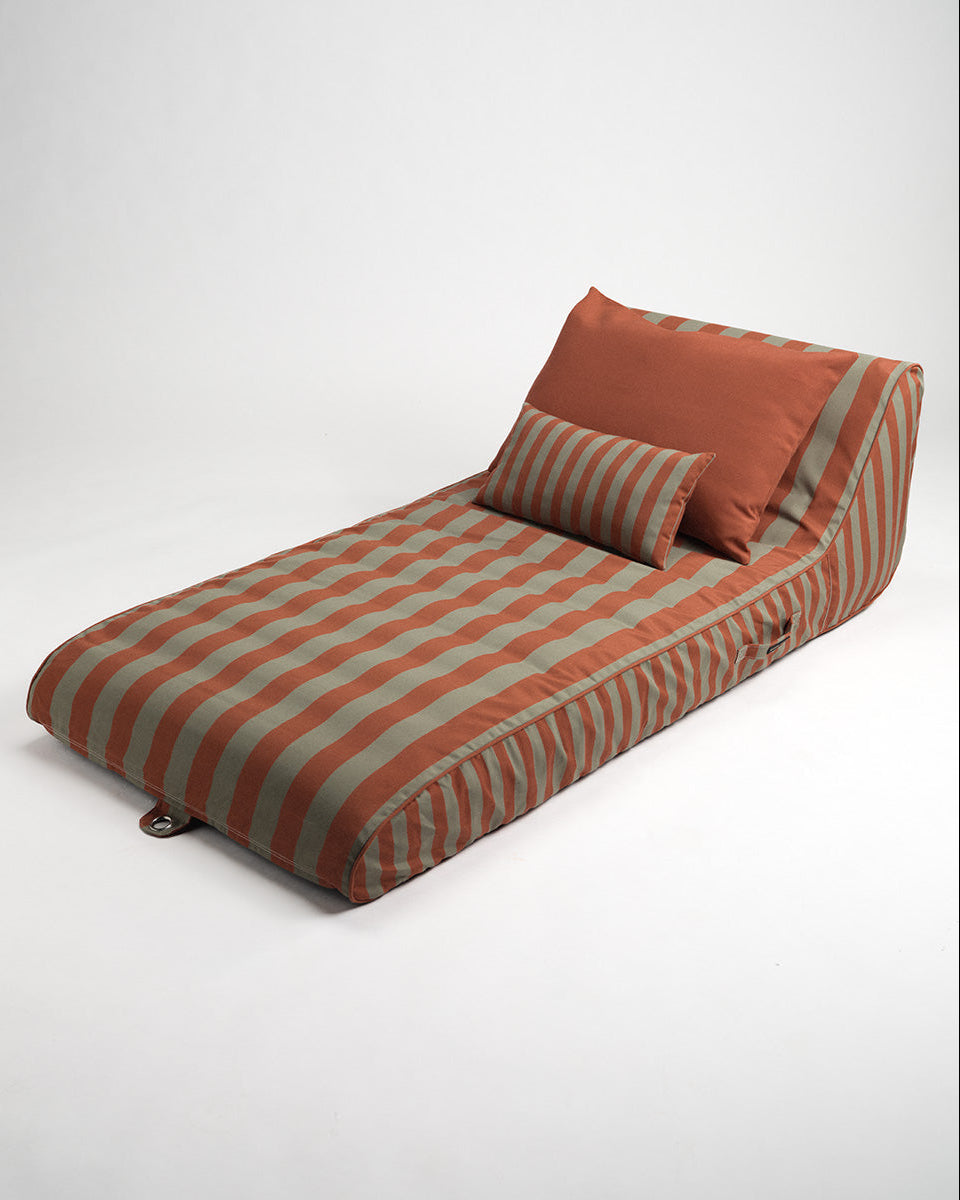 Striped Sun lounge with cushions on a white background