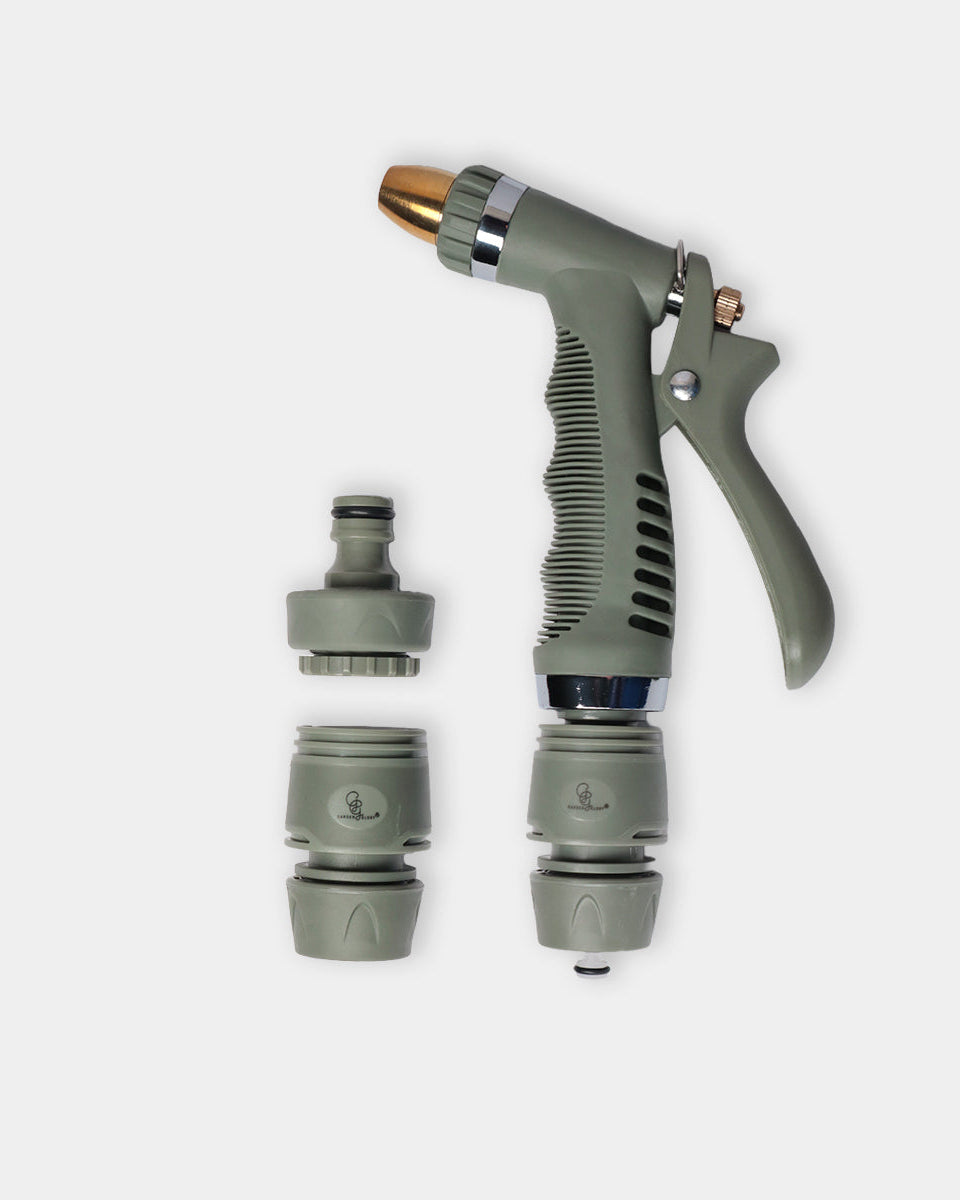 An eucalyptus green garden hose spray nozzle set with a main spray wand, a brass spray tip, and two interchangeable nozzles, displayed on a light gray background.