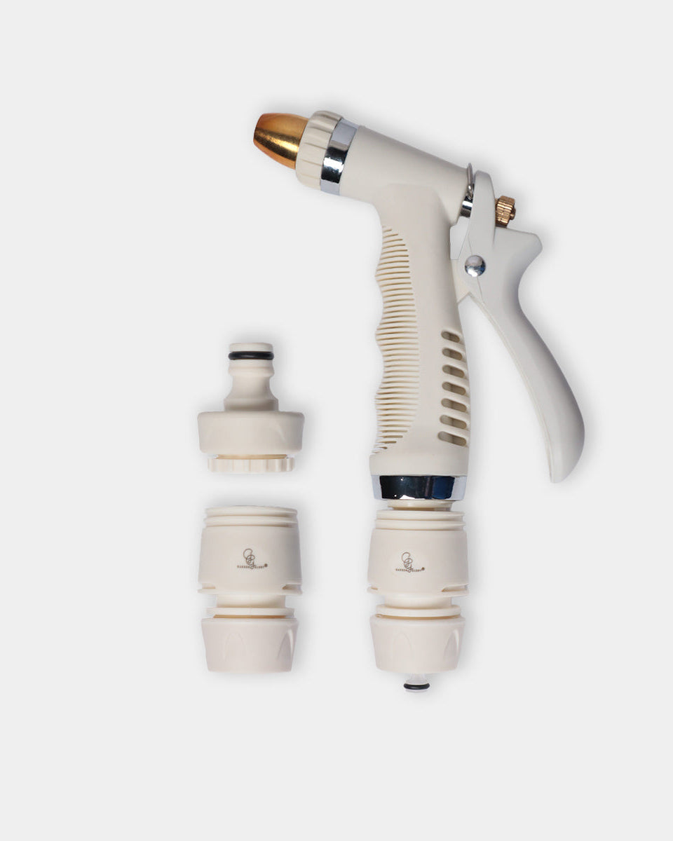 An off-white garden hose spray nozzle with a textured grip, shown alongside two interchangeable nozzle attachments on a light gray background.