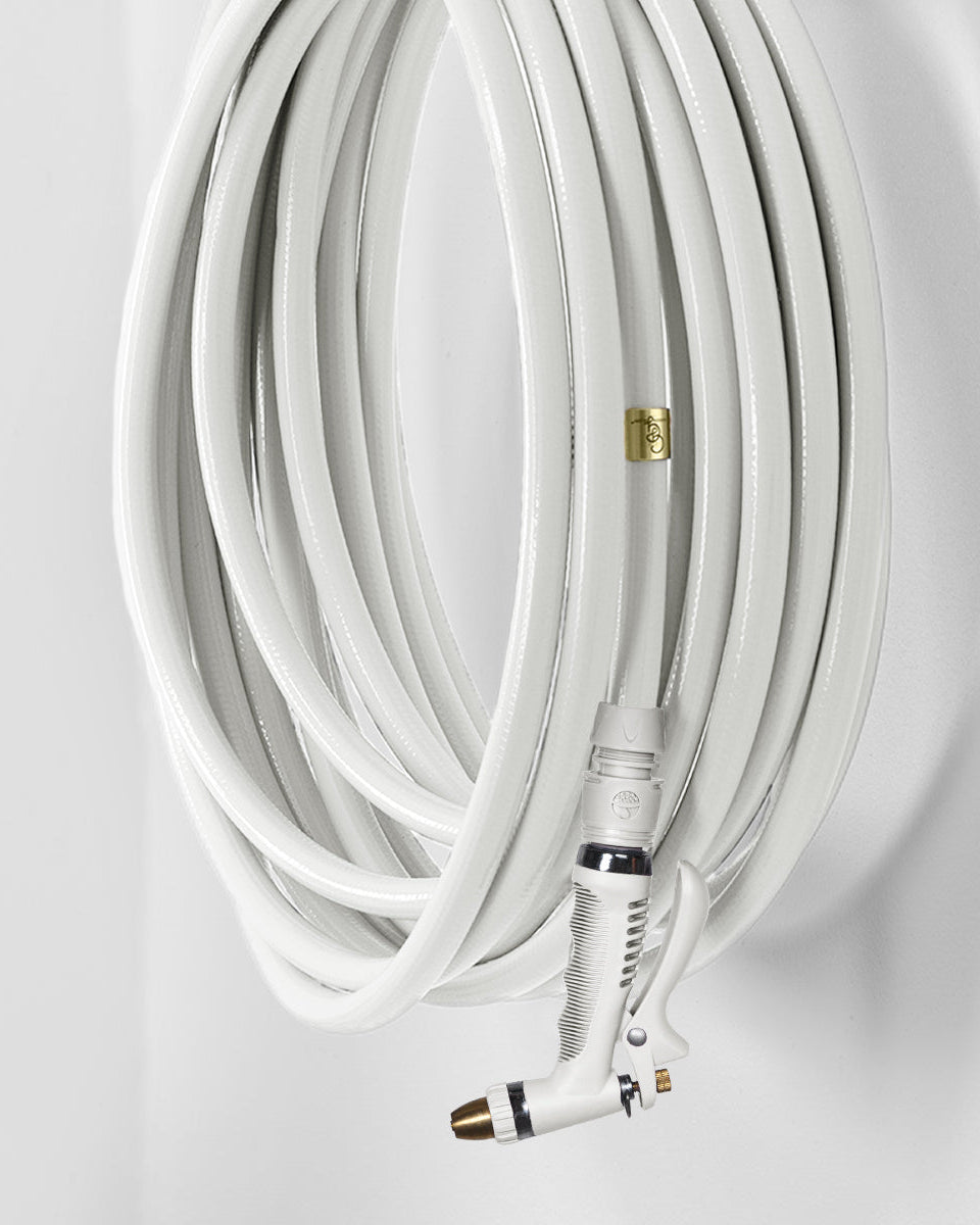 Garden hose with connectors on a light gray background